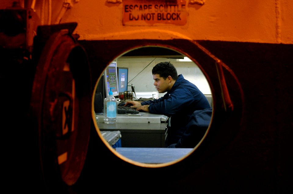 US Navy 090813-N-8960W-022 Aviation Boatswain's Mate (Fuel) 2nd Class Anorga Vidal monitors the transfer of fuel from storage tanks to the flight deck aboard the aircraft carrier USS Nimitz (CVN 68)