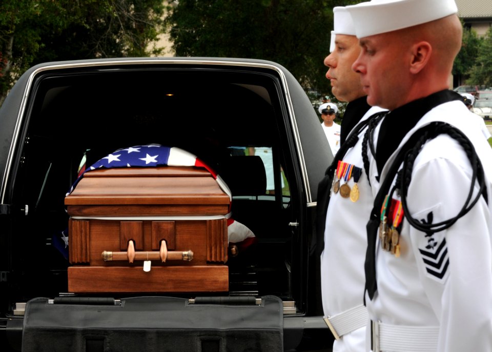 US Navy 090813-N-1522S-005 Members of a Navy honor guard carry the remains of Capt. Michael Scott Speicher to All Saints Chapel at Naval Air Station Jacksonville in Jacksonville, Fla