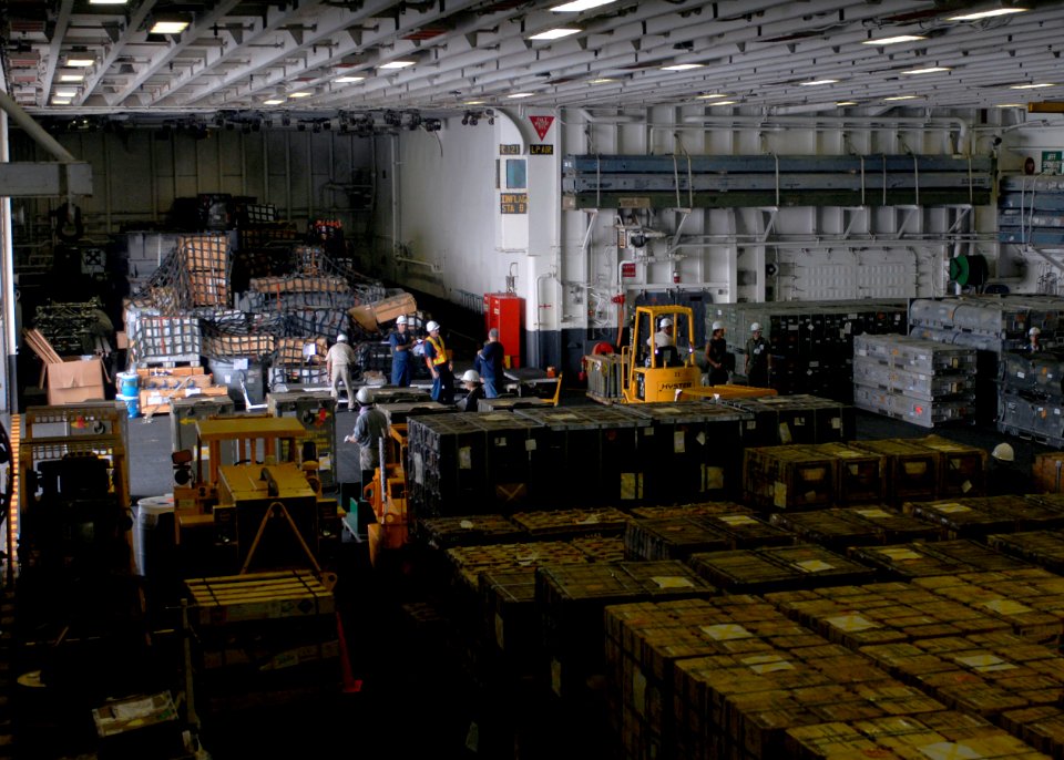 US Navy 090817-N-5215E-043 The amphibious assault ship USS Essex (LHD 2) moves staged ammunition out of the hangar bay before arriving at homeport in Sasebo, Japan