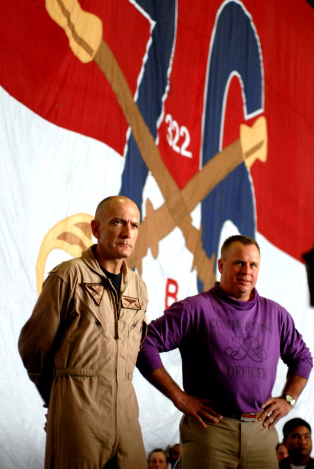 US Navy 090817-N-9132C-061 Capt. Thomas Lalor, CAG, CVW 14 and Capt. K.J. Norton, commanding officer of USS Ronald Reagan, listen to Vice Adm. Bill Gortney, commander, U.S. Naval Forces Central Command, during an all-hands call
