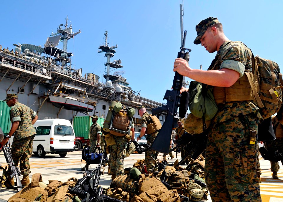 US Navy 090813-N-9950J-248 Marines of the 31st Marine Expeditionary Unit Battalion Landing Team, Third Battalion, Fifth Marines, debark Essex after exercise Talisman Saber 2009