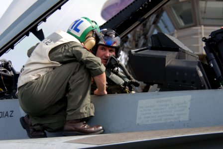 US Navy 090815-N-9132C-159 Royal Air Force Air Commodore Mark Hopkins, director of the Combined Air and Space Operations Center, right, receives a pre-launch briefing