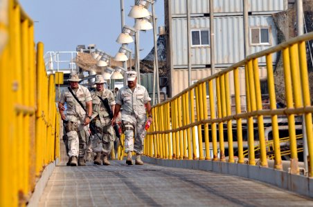 US Navy 090818-N-3659B-071 A group of Sailors transit a catwalk on the Al Basrah Oil Terminal (ABOT)