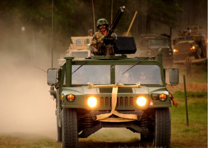 US Navy 090816-N-8816D-026 Members of the Naval Mobile Construction Battalion (NMCB) 133 Convoy Security Element escort fuel, water, equipment and supplies during a field training exercise at Camp Shelby, Miss photo