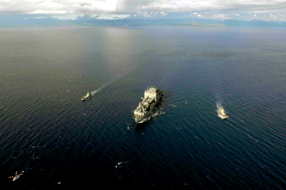US Navy 090814-N-9689V-007 The Military Sealift Command dry cargo-ammunition ship USNS Richard E. Byrd (T-AKE 4), and two Royal Australian Navy heavy landing craft, the HMAS Betano (L 133) and the HMAS Wewak (L 130),
