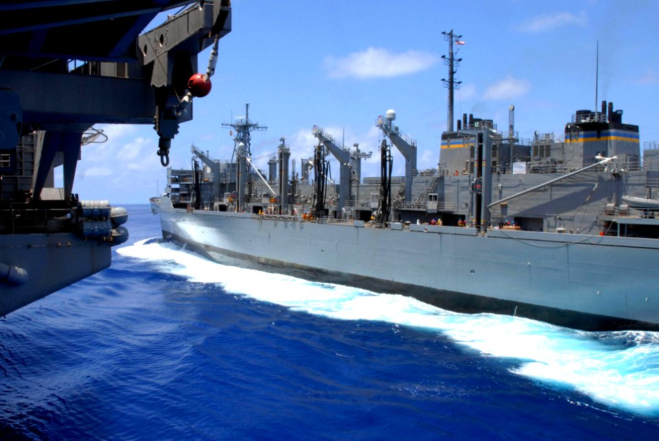 US Navy 090815-N-2600H-058 The Military Sealift Command fast combat support ship USNS Bridge (T-AOE 10) maneuvers into position before conducting a replenishment at sea with the aircraft carrier USS Nimitz (CVN 68)
