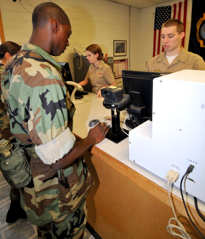 US Navy 090813-N-8848T-108 Midshipman 4th Class Nathandis Wiley, from Chicago, an incoming freshman at Illinois Institute of Technology (IIT), punches in his social security number for his first Navy identification card