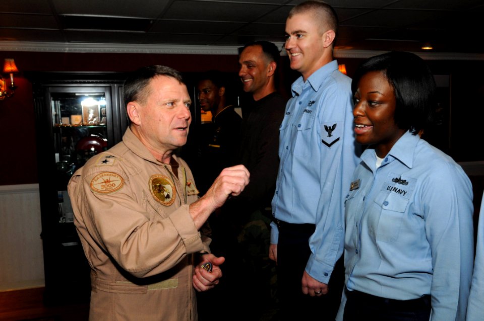 US Navy 090816-N-3610L-016 Vice Adm. William Gortney, Commander, U.S. 5th Fleet, left, jokes with Ship's Serviceman Seaman Ashley Rice aboard the aircraft carrier USS Ronald Reagan (CVN 76)