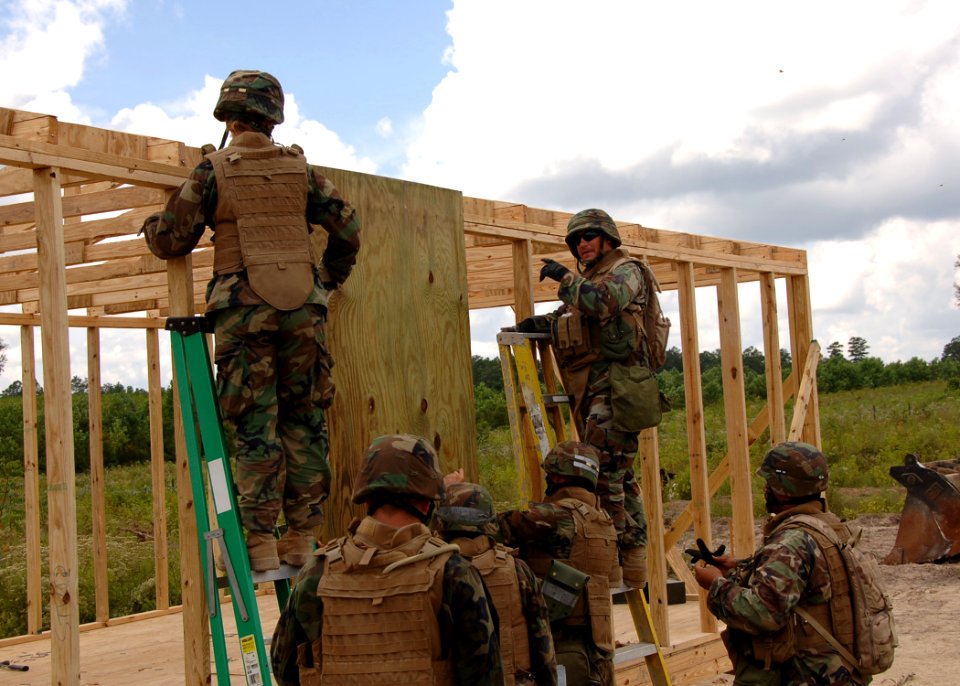 US Navy 090816-N-8816D-021 Seabees assigned to Naval Mobile Construction Battalion (NMCB) 133 build a Southwest Asia hut at Camp Shelby, Miss. during a field training exercise at Camp Shelby, Miss