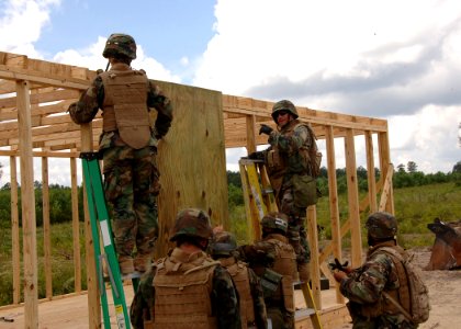 US Navy 090816-N-8816D-021 Seabees assigned to Naval Mobile Construction Battalion (NMCB) 133 build a Southwest Asia hut at Camp Shelby, Miss. during a field training exercise at Camp Shelby, Miss