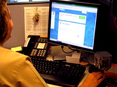 US Navy 090819-N-0429H-001 Lt. Cmdr. Heather Watts, deputy judge advocate general corps officer for the Chief of Naval Operations Environmental Readiness Division (N45), clicks a link to an environmental article on Navy.mil fro