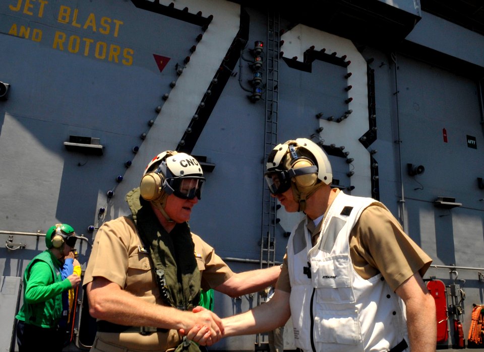 US Navy 090819-N-8273J-356 Chief of Naval Operations (CNO) Adm. Gary Roughead, left, thanks Capt. David Lausman, commanding officer of the Nimitz-class aircraft carrier USS George Washington (CVN 73)