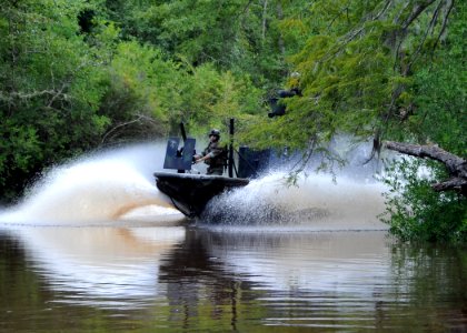 US Navy 090816-N-4205W-017 Special warfare combatant-craft crewmen (SWCC) from Special Boat Team (SBT) 22 operate a special operations craft-riverine during the filming of a scene in a upcoming major motion picture photo