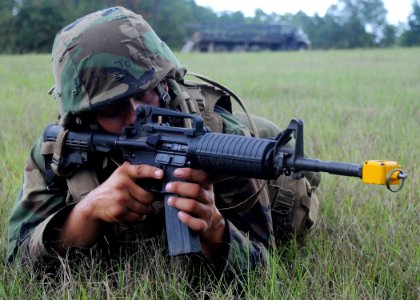 US Navy 090819-N-1120L-036 A Seabee assigned to Naval Mobile Construction Battalion (NMCB) 22 conducts an immediate action drill during a field training exercise