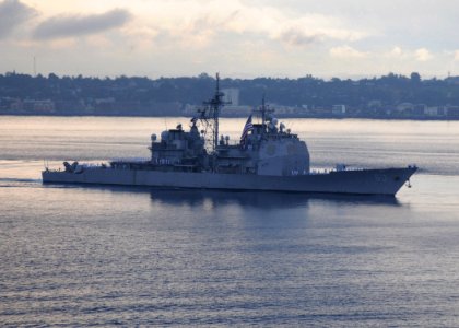 US Navy 090819-N-1644H-385 The guide missle cruiser USS Cowpens (CG 63) is underway in formation behind the aircraft carrier USS George Washington (CVN 73) during the Indonesian International Fleet Review