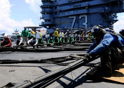 US Navy 090821-N-1062H-026 Sailors aboard USS George Washington (CVN 73) prepare to raise the Ready-Jet aircraft barricade while conducting a flight deck drill