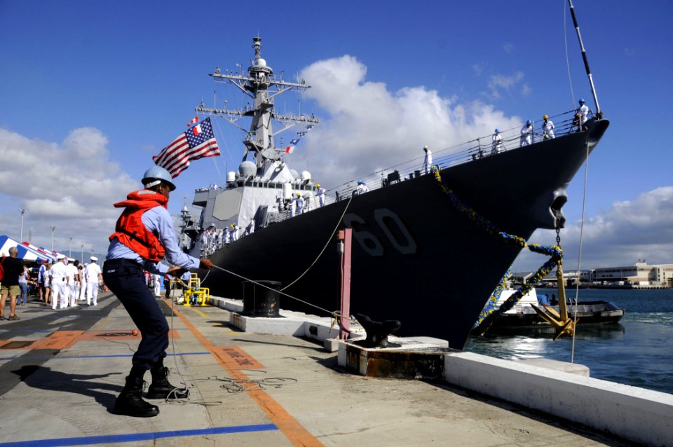 US Navy 090821-N-7498L-083 Seaman Kehmal Nelson, from New York, secures mooring lines as the guided-missile destroyer USS Paul Hamilton (DDG 60) returns to homeport at Naval Station Pearl Harbor