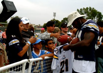 US Navy 090821-N-0483R-050 San Diego Charger Tim Dobbins signs autographs for service members and their families at Naval Base San Diego during a 45-minute no-pads practice photo