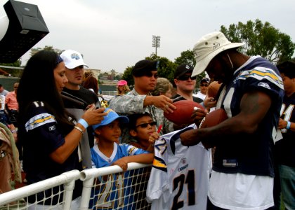 US Navy 090821-N-0483R-050 San Diego Charger Tim Dobbins signs autographs for service members and their families at Naval Base San Diego during a 45-minute no-pads practice