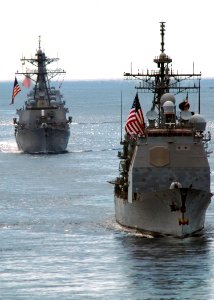 US Navy 090819-N-8534H-001 The guided missile cruiser USS Cowpens (CG 63) and the guided missile destroyer USS Fitzgerald (DDG 62) transits Manaso Bay during the Indonesian International Fleet Review, which commemorates the 64t