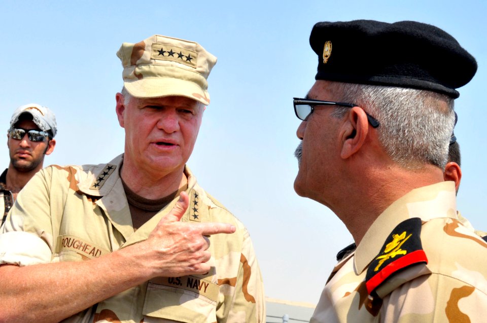 US Navy 090822-N-8273J-246 Chief of Naval Operations (CNO) Adm. Gary Roughead, right, visits the Iraqi Navy patrol ship Fetah (701) with Cmdr. Ahmed Jasim, commanding officer of Umm Qasr Naval Base