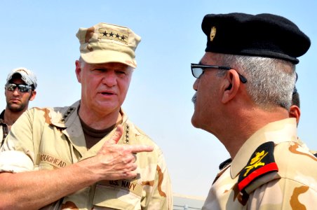 US Navy 090822-N-8273J-246 Chief of Naval Operations (CNO) Adm. Gary Roughead, right, visits the Iraqi Navy patrol ship Fetah (701) with Cmdr. Ahmed Jasim, commanding officer of Umm Qasr Naval Base
