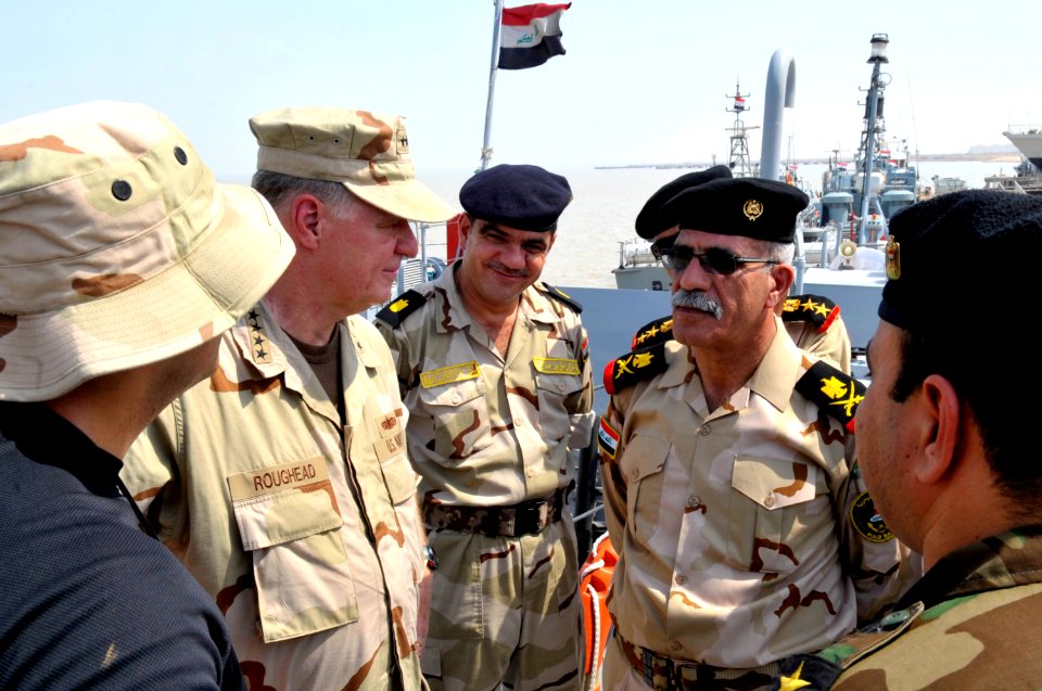 US Navy 090822-N-8273J-250 Chief of Naval Operations (CNO) Adm. Gary Roughead, right, visits the Iraqi Navy patrol ship Fetah (701) with Cmdr. Ahmed Jasim, commanding officer of Umm Qasr Naval Base