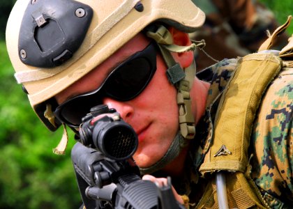 US Navy 090820-N-9573A-013 Lance Cpl. Donald Cox III, of Huntley, Ill., from Fleet Anti-terrorism Security Team, Company Pacific (FASTPAC) demonstrates how to secure a pier