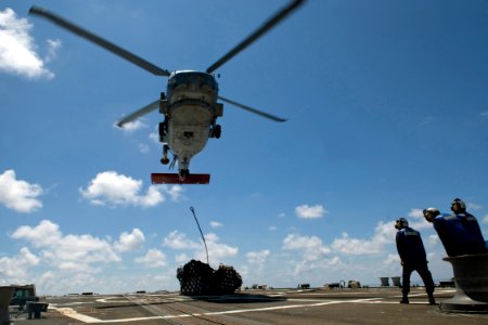 US Navy 090823-N-9123L-057 An SH-60B Sea Hawk helicopter assigned to the Warlords of Helicopter Anti-submarine Squadron Light (HSL) 51, Det. 5, delivers stores to the guided-missile destroyer USS McCampbell (DDG 85) during a ve