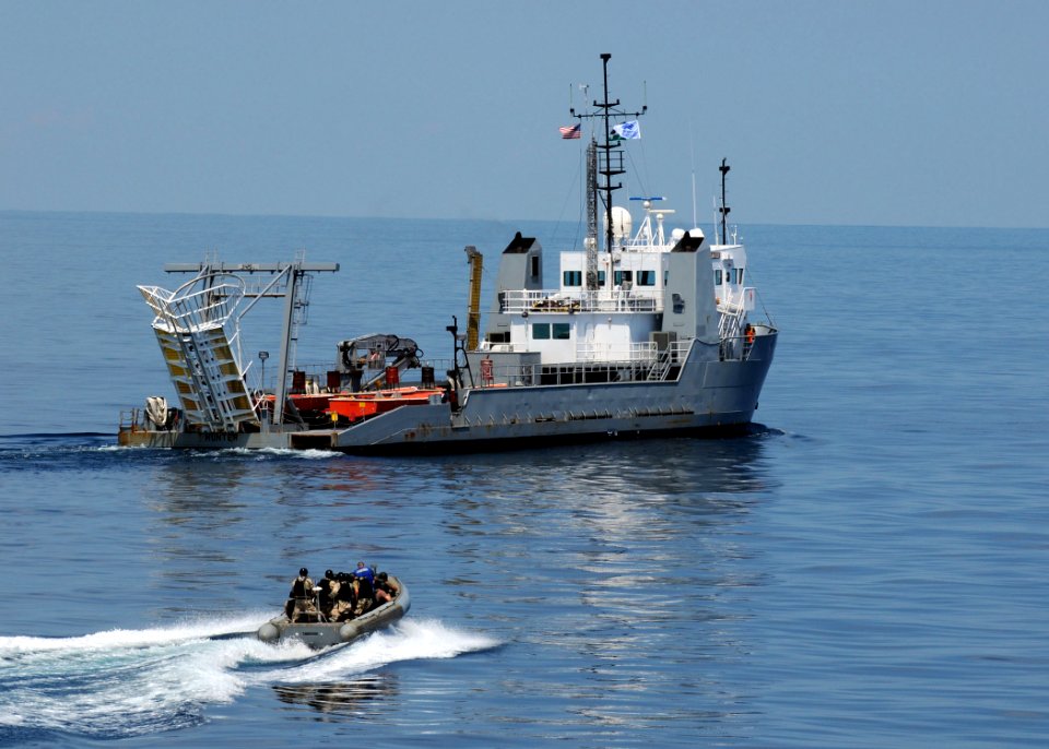 US Navy 090824-N-1522S-005 A visit, board, search, and seizure team from the guided-missile destroyer USS Farragut (DDG 99) approaches the Navy training boat USNS Hunter (8202) during a visit, board, search, and seizure trainin