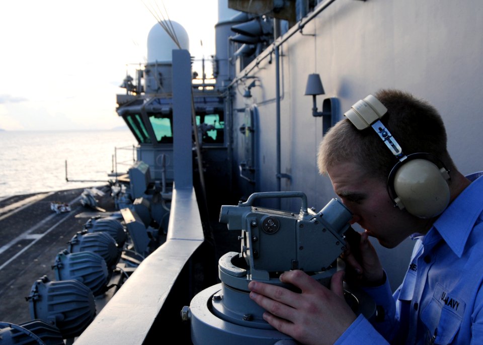 US Navy 090822-N-1644H-071 Quartermaster 3rd Class William Stephens, assigned to the navigation department of the aircraft carrier USS George Washington (CVN 73), takes a navigational reading with a sexton