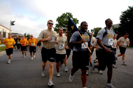 US Navy 090822-N-9818V-258 Chief petty officer selects run with their guideons in the fifth annual Run with the Chiefs 5 kilometer run at Naval Station Norfolk