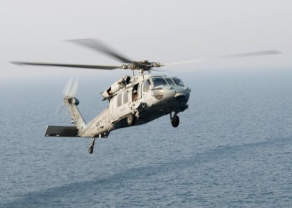 US Navy 090824-N-3165S-051 An MH-60S Sea Hawk helicopter assigned to Helicopter Sea Combat Squadron (HSC) 22 prepares to land aboard the amphibious assault ship USS Bataan (LHD 5) photo