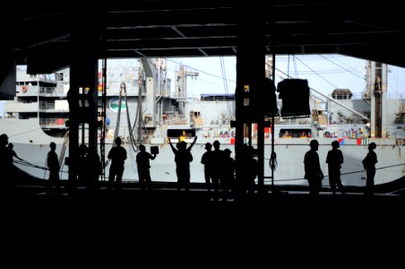 US Navy 090820-N-9132C-065 Sailors aboard the aircraft carrier USS Ronald Reagan (CVN 76) receive cargo from the Military Sealift Command fast combat-support ship USNS Rainier (T-AOE 7) during a replenishment at sea photo