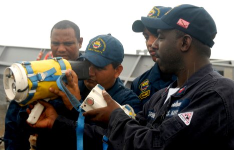 US Navy 090824-N-4879G-356 Damage Controlman 1st Class Andrae Johnson explains the use and functions of the naval fire fighter thermal imagery device