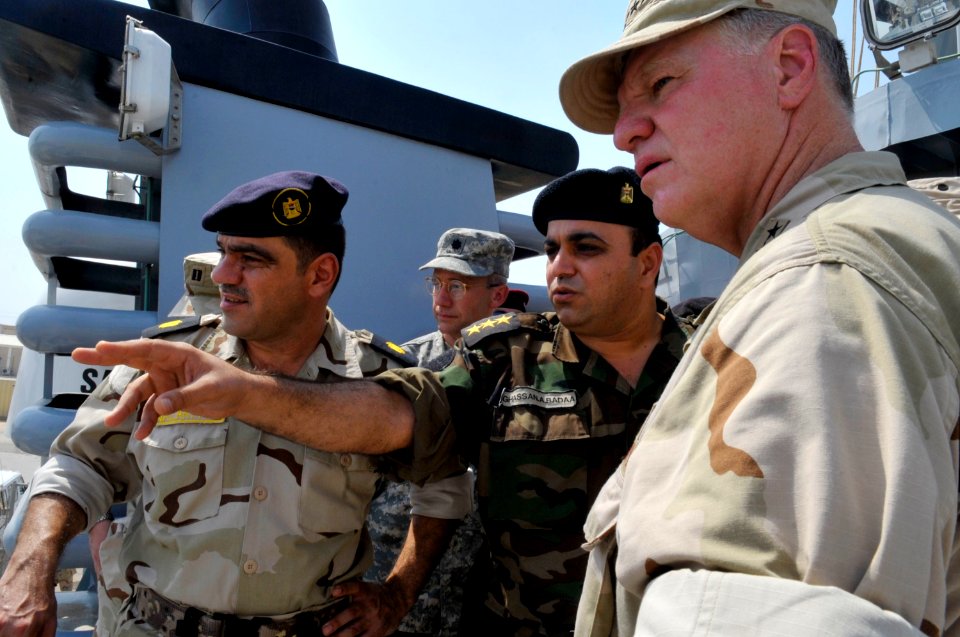 US Navy 090822-N-8273J-230 Chief of Naval Operations (CNO) Adm. Gary Roughead, right, visits the Iraqi Navy patrol ship Fetah (701) with Cmdr. Ahmed Jasim, commanding officer of Umm Qasr Naval Base