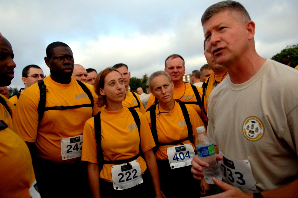 US Navy 090822-N-9818V-100 Master Chief Petty Officer of the Navy (MCPON) Rick West speaks with chief petty officer selects before the start of the fifth annual Run with the Chiefs 5 kilometer run at the parade grounds at Naval