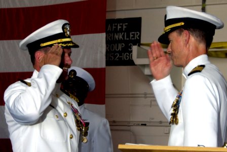 US Navy 090824-N-3038W-143 Capt. Paul O. Monger relieves Capt. Michael C. Manazir as commanding officer of the aircraft carrier USS Nimitz (CVN 68)