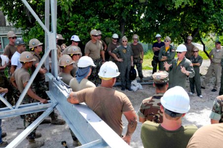 US Navy 090826-N-9689V-005 Adm. Robert F. Willard, Commander, U.S. Pacific Fleet, thanks engineers from the U.S. Navy, Australia and Canada for their work reconstructing the Tanaea-Buota Bridge