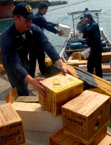 US Navy 090823-N-4879G-140 Gunner's Mate 2nd Class Matthew Mcmurray brings medical supplies ashore during a Project Handclasp delivery to a Colombian Coast Guard vessel