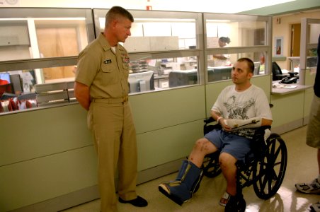 US Navy 090821-N-9818V-008 Master Chief Petty Officer of the Navy (MCPON) Rick West speaks with Construction Mechanic 2nd Class Michael Shepard during his visit to the Hunter Holmes McGuire Richmond VA Medical Center