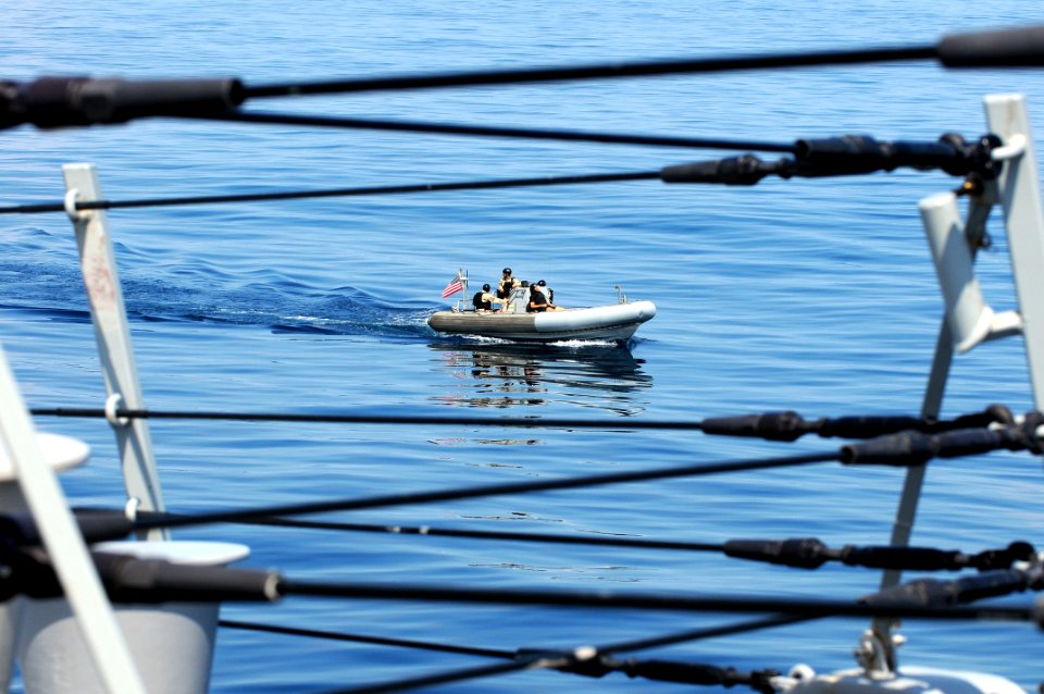 US Navy 090824-N-1522S-011 A visit, board, search, and seizure team from the guided-missile destroyer USS Farragut (DDG 99) approaches the Navy training boat USNS Hunter (8202) during a visit, board, search, and seizure trainin