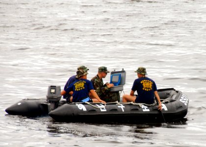 US Navy 090827-N-9573A-002 Construction Electrician 3rd Class Michael Mace, from Port Hueneme, Calif. assigned to Underwater Construction Team (UCT) 2, uses a Bathymetric Survey System during a training exercise photo