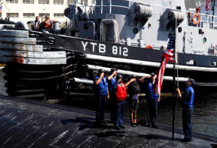 US Navy 090826-N-9928E-085 Sailors aboard the Los Angeles-class attack submarine USS Bremerton (SSN 698) raise the national ensign after pulling into port at Naval Base Kitsap, Wash., for a scheduled port visit