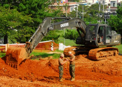 US Navy 090826-N-9573A-002 eabees assigned to Naval Mobile Construction Battalion (NMCB) 1 level the land for a sports complex