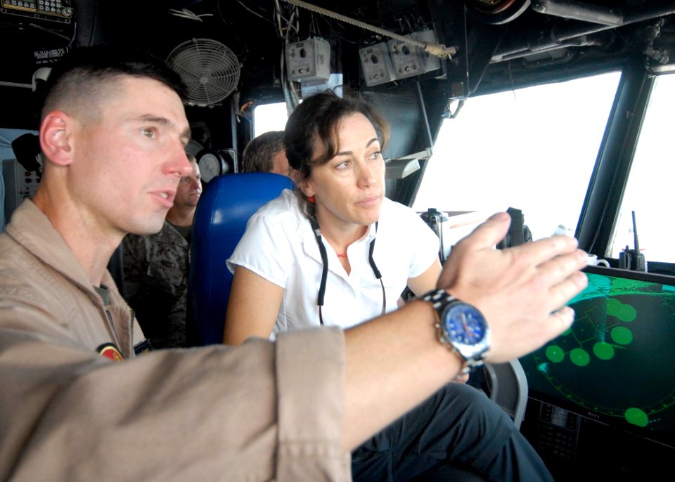 US Navy 090828-N-3592S-110 Lt. Col. Thomas Mitalski, executive officer of the 24th Marine Expeditionary Unit (24th MEU) Air Combat Element, discusses flight deck operations with Deputy Assistant Secretary of Defense for Plans J