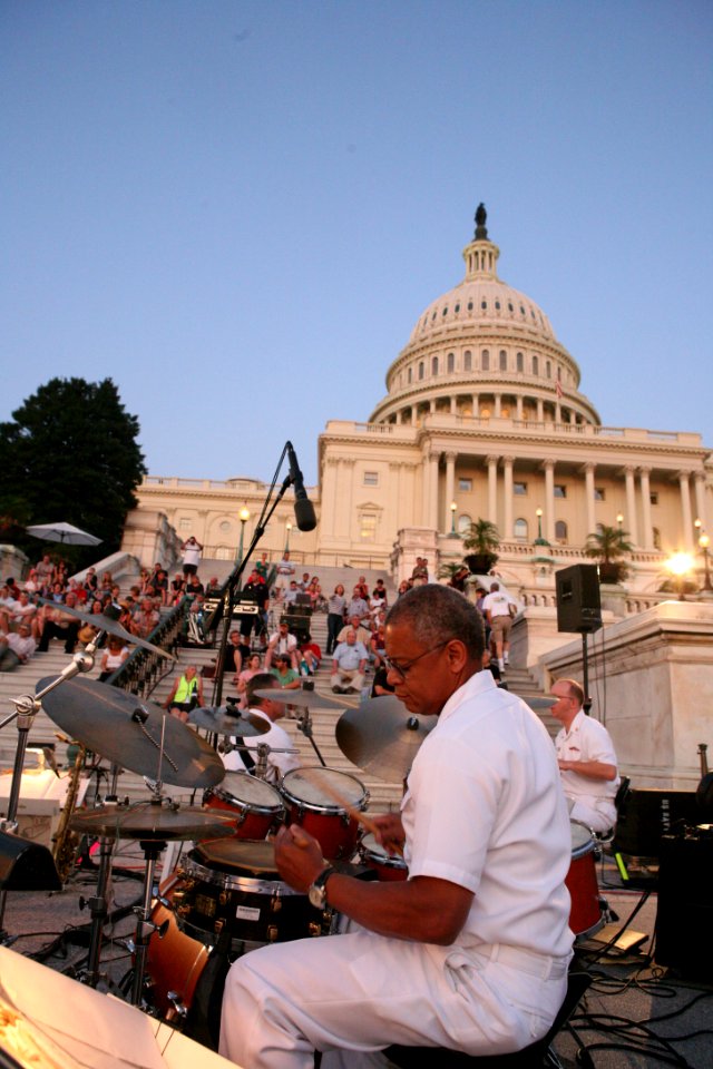 US Navy 090824-N-4936C-001 Chief Musician John T. Parsons plays the drums during a Summer Concert Series concert on the steps of the U.S. Capitol