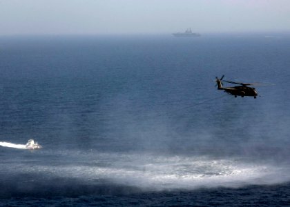 US Navy 090830-N-3165S-098 An MH-53 Sea Dragon, assigned to the Blackhawks of Helicopter Mine Countermeasures Squadron (HM) 15, tows a Mk-105 magnetic influence mine sweeping system