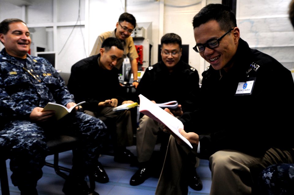 US Navy 090901-N-3830J-001 Republic of Korea Navy officers discuss mission planning with embarked U.S. 7th Fleet staff Sailors