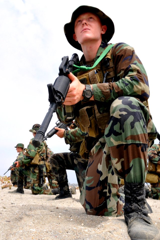 US Navy 090831-N-7883G-055 Basic Underwater Demolition-SEAL (BUD-S) students conduct a patrolling exercise during the third phase of training at Naval Amphibious Base Coronado photo